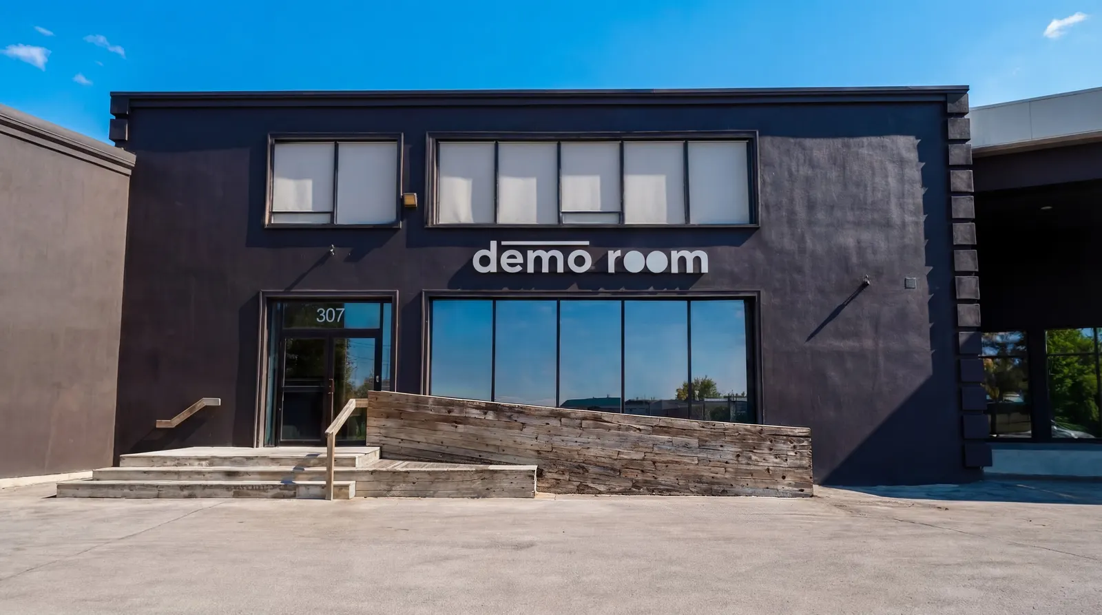 The Demo Room building from the street, its name above the entrance