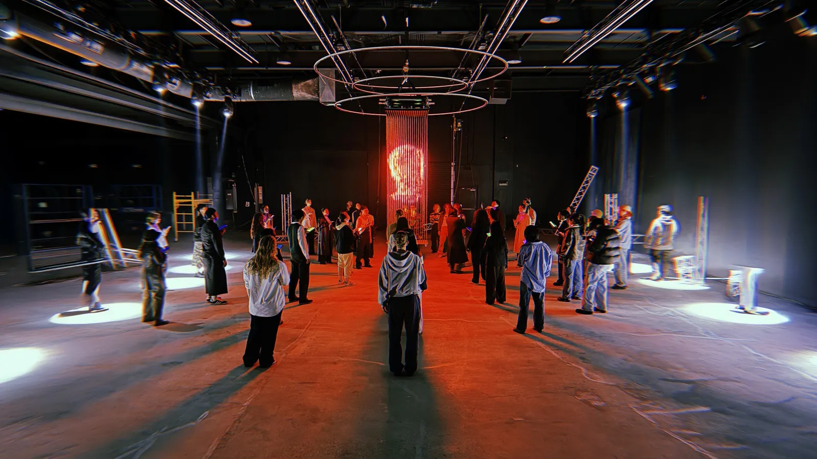 A casting in Demo Room, models standing across the lit floor