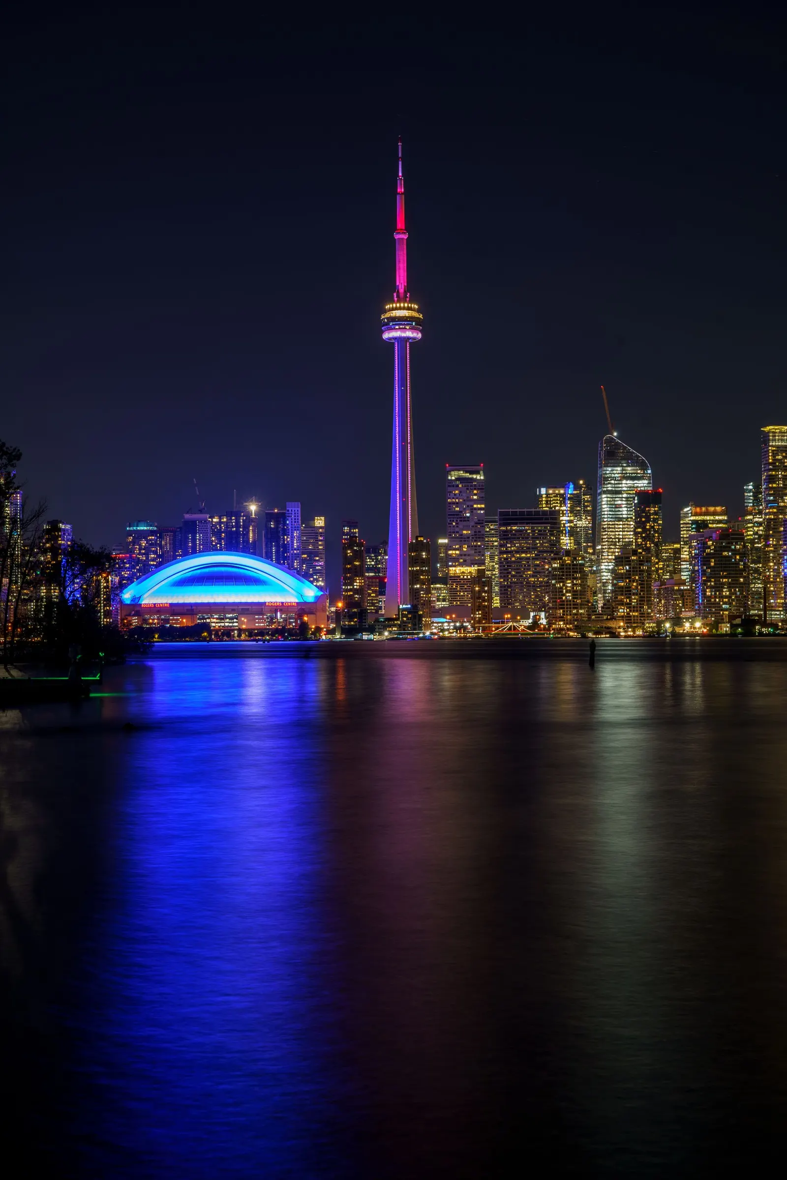 The Toronto skyline at night, seen across the lake